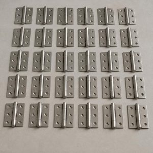 gpt-image-2_A_photographic_image_of_40_units_of_common_2-inch_hinges_made_of_metal_with_a_re-0